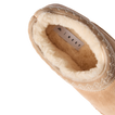 Indie Slipper close-up facing upper left, showing plush fleece lining and cushioned footbed