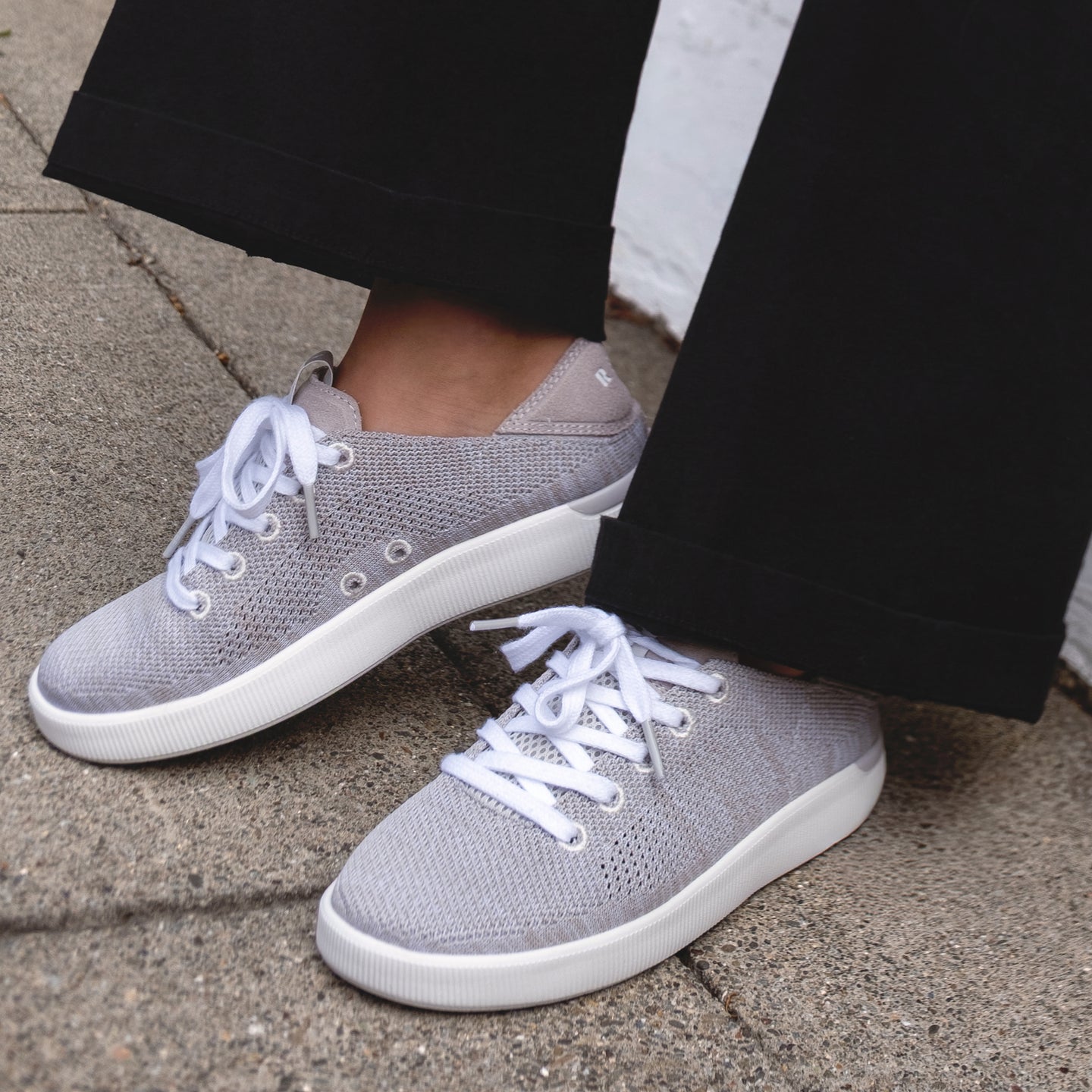 Reef Neptune women's gray sneakers facing left and right, breathable knit upper, cushioned sole, easy on and off design.