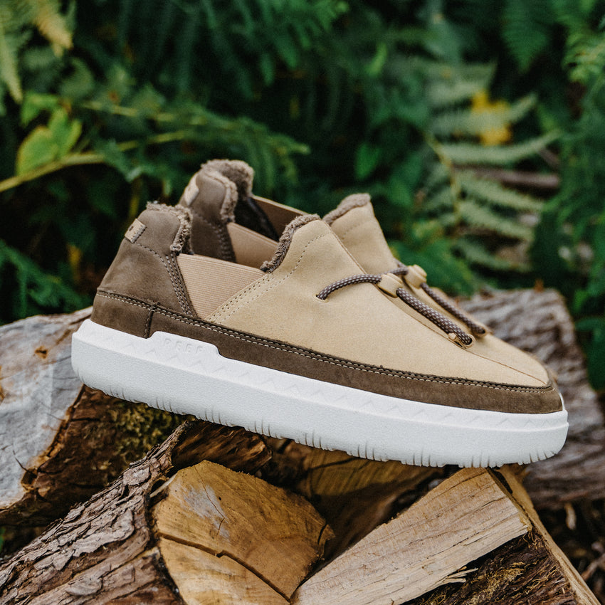 Rambler tan suede shoe facing right on a log with a cushioned white EVA outsole