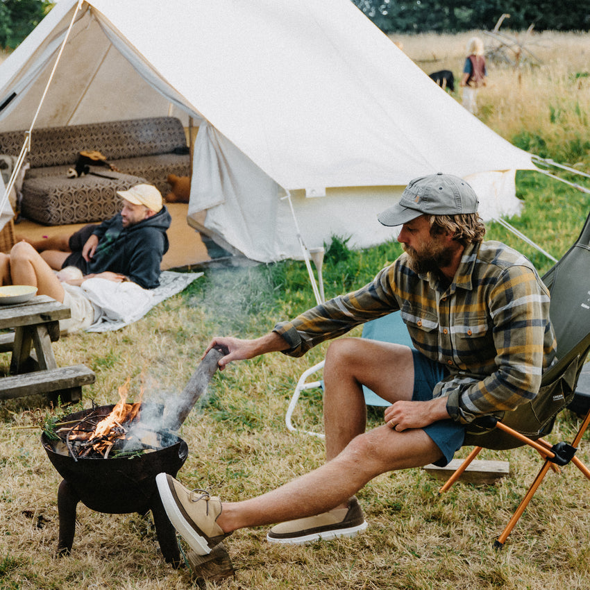 Rambler suede shoes facing left at a campsite with cushioned EVA outsoles