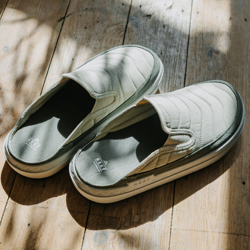 Rambler Kicker slip on mules with toe fronts facing right showing quilted uppers and open heel design