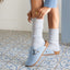 Vista Serenity women's blue clogs facing right, close-up on upper and buckle, featuring arch support and cushioning.