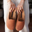 Vista Skye women’s slip-on shoes held facing forward, showcasing soft-rebound cushioned footbed and durable caramel upper.
