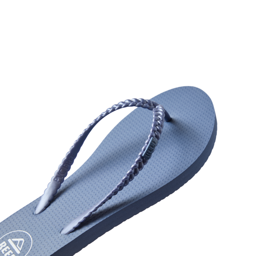Seaside Twist women's flip flop facing right with braided straps, cushioned footbed, and water-friendly design.