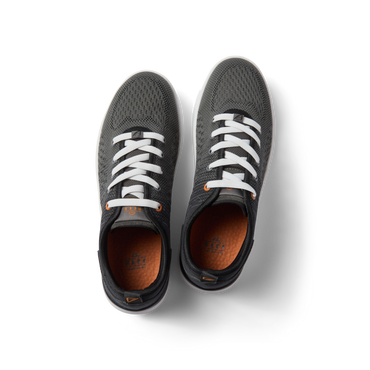 Top view of black Neso men's sneakers with white laces, featuring breathable mesh, arch support, and soft-rebound cushioning.