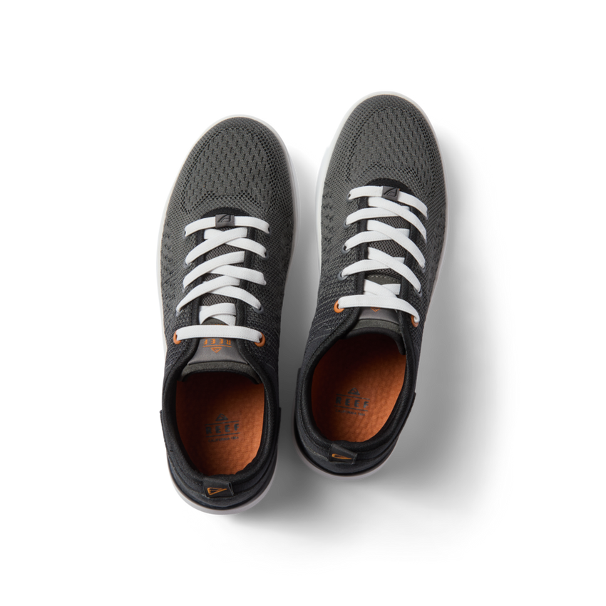 Top view of black Neso men's sneakers with white laces, featuring breathable mesh, arch support, and soft-rebound cushioning.