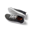 Pair of black and white Neso men's sneakers featuring anatomical arch support, soft cushioning, and rubber outsole, right shoe facing left.