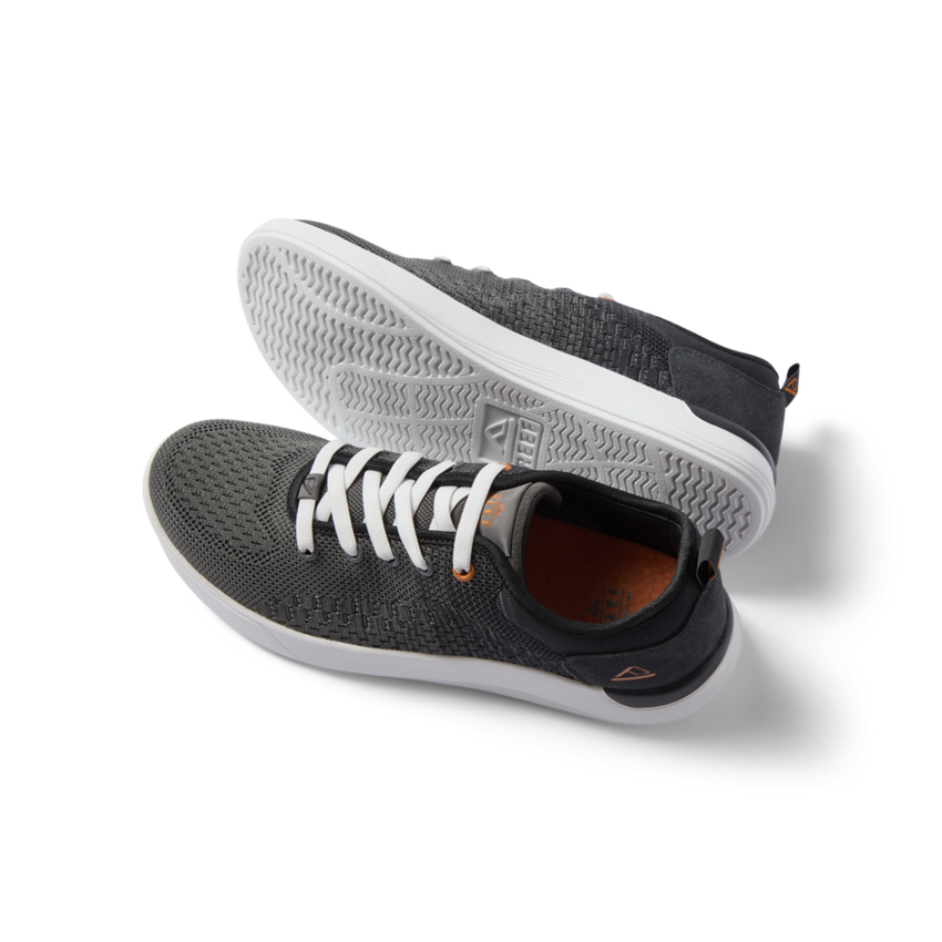 Pair of black and white Neso men's sneakers featuring anatomical arch support, soft cushioning, and rubber outsole, right shoe facing left.