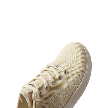 Front-facing Neso men's sneaker in off-white with breathable knit upper, cushioned sole, and anatomical arch support.