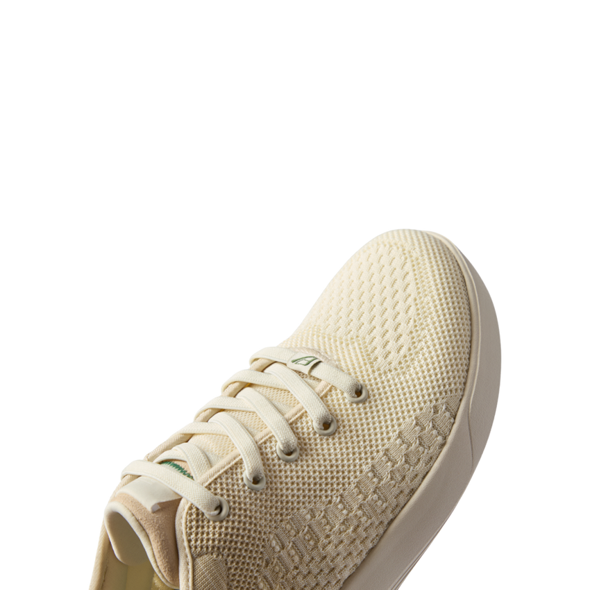 Front-facing Neso men's sneaker in off-white with breathable knit upper, cushioned sole, and anatomical arch support.