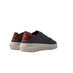 Atlantic men's navy and cappuccino sneakers facing away, highlighting heel with arch support and cushioned sole.