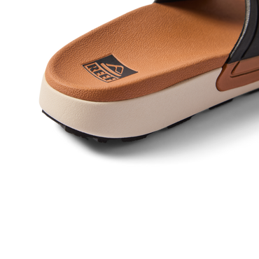 Close-up of the heel area of the Sydnee Cutback Low sandal facing left, featuring soft-rebound cushioning and arch support.