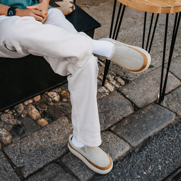 Rambler Mule cream leather mules with toes facing right worn outdoors for everyday comfort