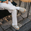Rambler Mule cream leather mules with toes facing right worn outdoors for everyday comfort