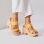 Close-up of women's Sunset Ibiza platform sandals in golden apricot facing left, highlighting comfort and beach-inspired style.