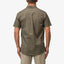 Back view of a man wearing the olive Topaz Shirt, showcasing its comfortable, beach-inspired casual style.
