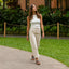 Woman walking outdoors wearing Vista Luxe Thea sandals facing forward, showcasing comfort and beach-inspired design.