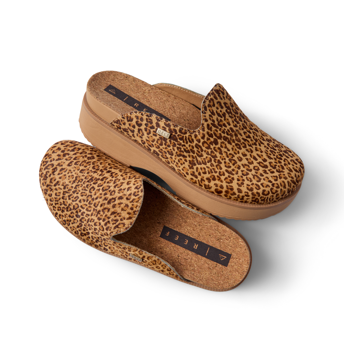 Vista Skye leopard print platform clogs one facing right and one facing left with cushioned footbeds