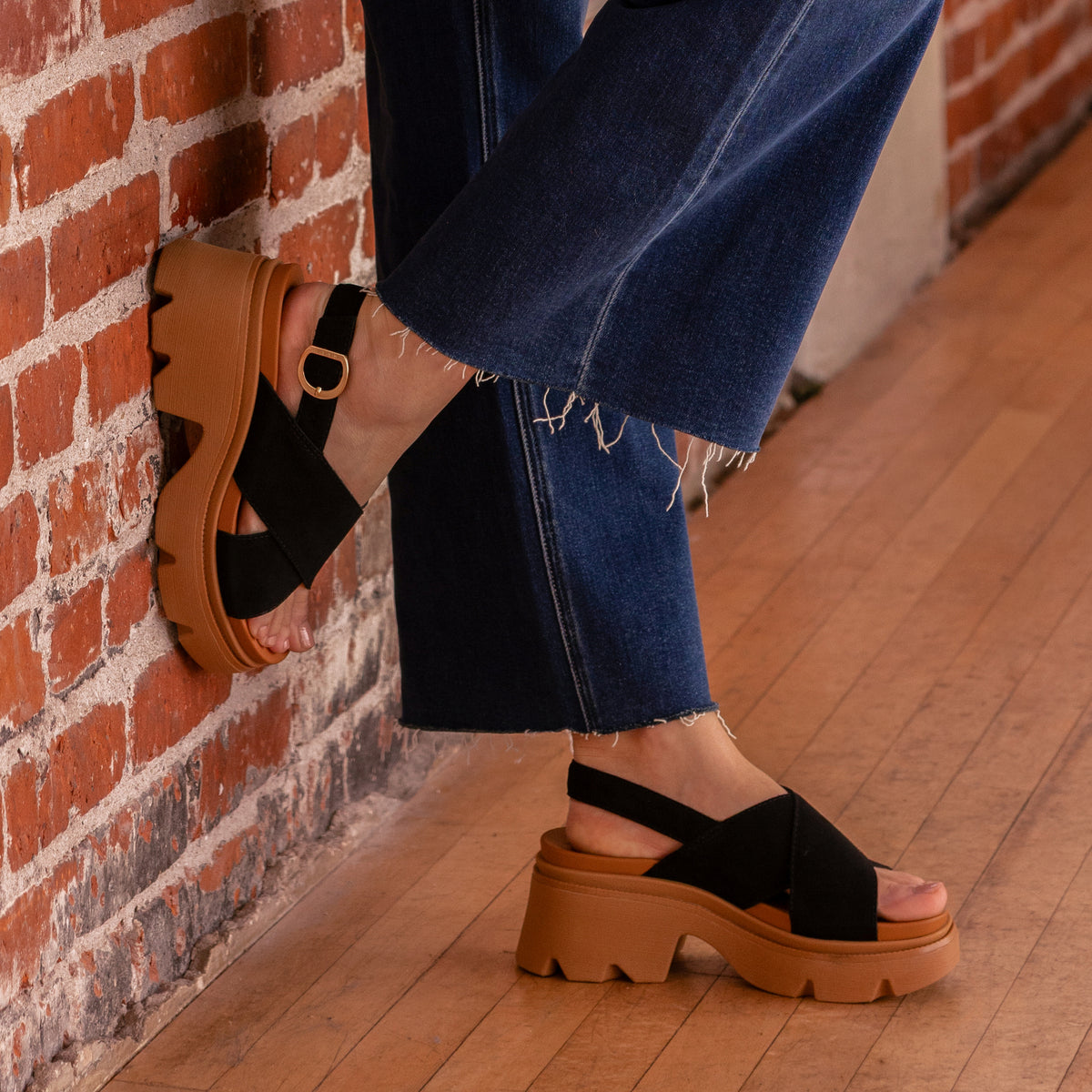 Vista Luxe Ava black suede platform sandals with arch support, shown from the side with toes facing right
