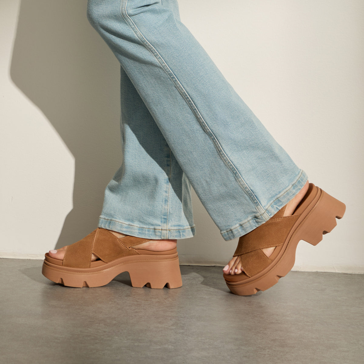 Vista Luxe Ava brown suede platform sandals facing left, featuring crossover straps and a cushioned arch support footbed