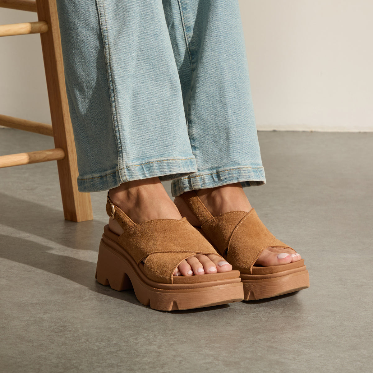 Vista Luxe Ava suede platform sandals with toes facing right, cushioned arch support, and crossover straps