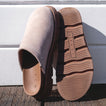 Vista Luxe Mariana clogs in beige suede, left shoe facing right showing closed toe, right shoe sole up with REEF logo visible