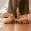 Side view of women's Vista Luxe Solene platform clogs in beige suede, featuring adjustable buckle straps and chunky soles.