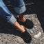 Vista Myra black clogs viewed from above, toes facing right, worn with rolled denim for everyday comfort