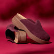 Vista Skye suede platform clogs facing right on a burgundy background