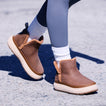 Weekend Autumn brown cozy boots, one facing right and one facing left, with shearling lining and cushioned soles