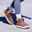 Weekend Autumn brown cozy boots, one facing right and one facing left, with shearling lining and cushioned soles
