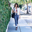 Weekend Autumn women's brown cozy shoes facing forward as a woman walks on a sunny sidewalk