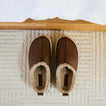 Weekend Low Brooke brown leather mules facing upward with cozy shearling lining