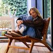 Weekend Low Brooke brown clogs facing left, shown on a seated woman for cozy everyday comfort