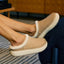 Weekend Low Brooke tan slip-on shoes facing right, shown in side view with soft fleece lining and cushioned soles