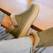 Weekend Olivia olive green boots facing right with plush faux fur lining and grippy lightweight soles