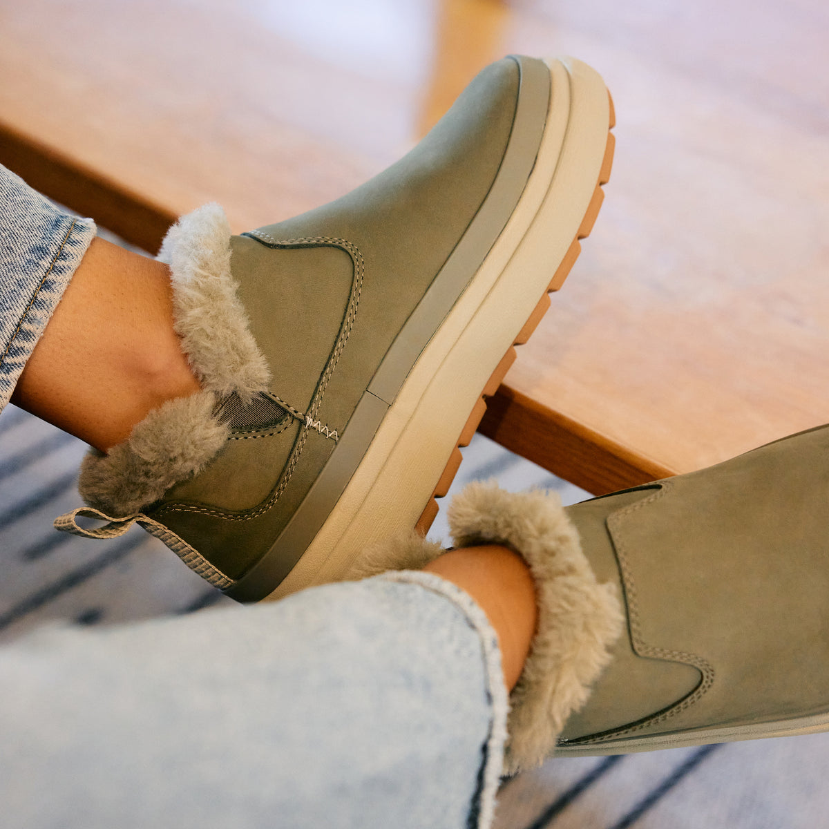 Weekend Olivia olive green boots facing right with plush faux fur lining and grippy lightweight soles