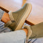 Weekend Olivia olive green boots facing right with plush faux fur lining and grippy lightweight soles