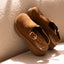 Vista Skye Rosa women's brown leather clog facing left with adjustable backstrap, plush lining, and cushioned sole close-up.