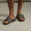 Fanning + Slide facing forward, men's grey water-friendly sandals with oversized airbag heel and cushioned molded footbed.